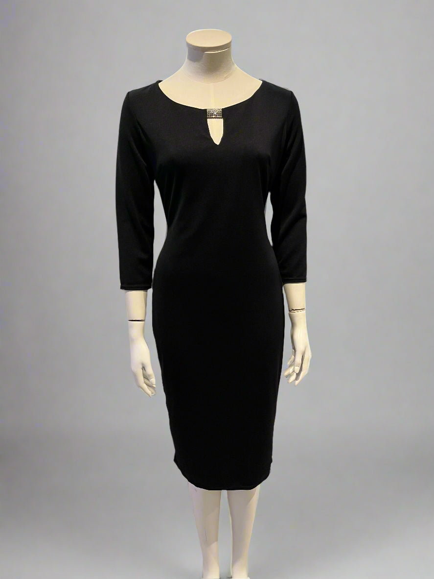 Black dress on a mannequin against a neutral background