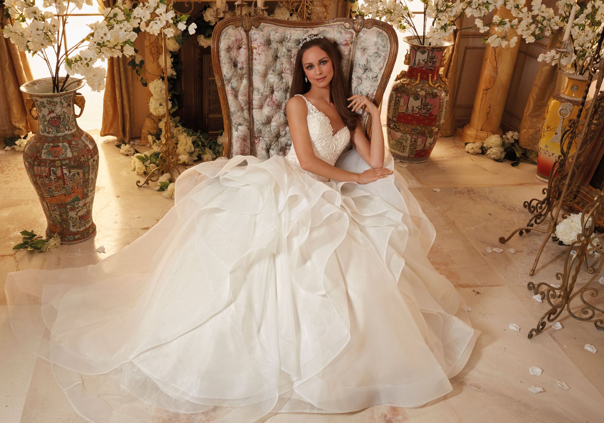 Bride sitting in a wing backed chair